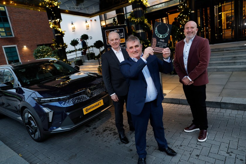 Tom Dennigan, Continental Tyres Ireland; Seamus Morgan, Renault Ireland; and Daragh Keany, MMAI Chairman; with the Renault Scenic E-Tech Electric.